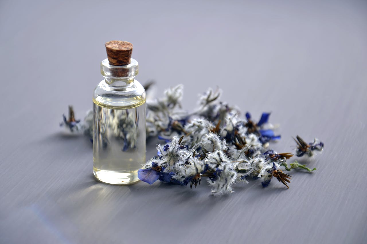 heros-img Close-up of a lavender oil bottle with dried flowers for aromatherapy. Perfect for wellness themes.
